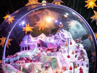 The giant snow globe in the Ice Palace on the Jungfrau Joch, surrounded by glowing stars.