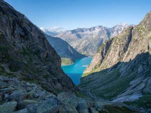 View from the Gelmerhütte of Lake Gelmer. The reservoir glows a beautiful glacier blue.