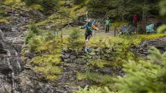 Rope bridge building over the glacier gorge