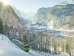 The Wengernalpbahn on its way from Lauterbrunnen to Wengen. In the background, the Lauterbrunnen Valley in winter.