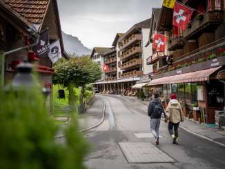 A mini-golf course in the village of Wengen, set up in rainy weather with various stations, all themed around the Lauberhorn Race.