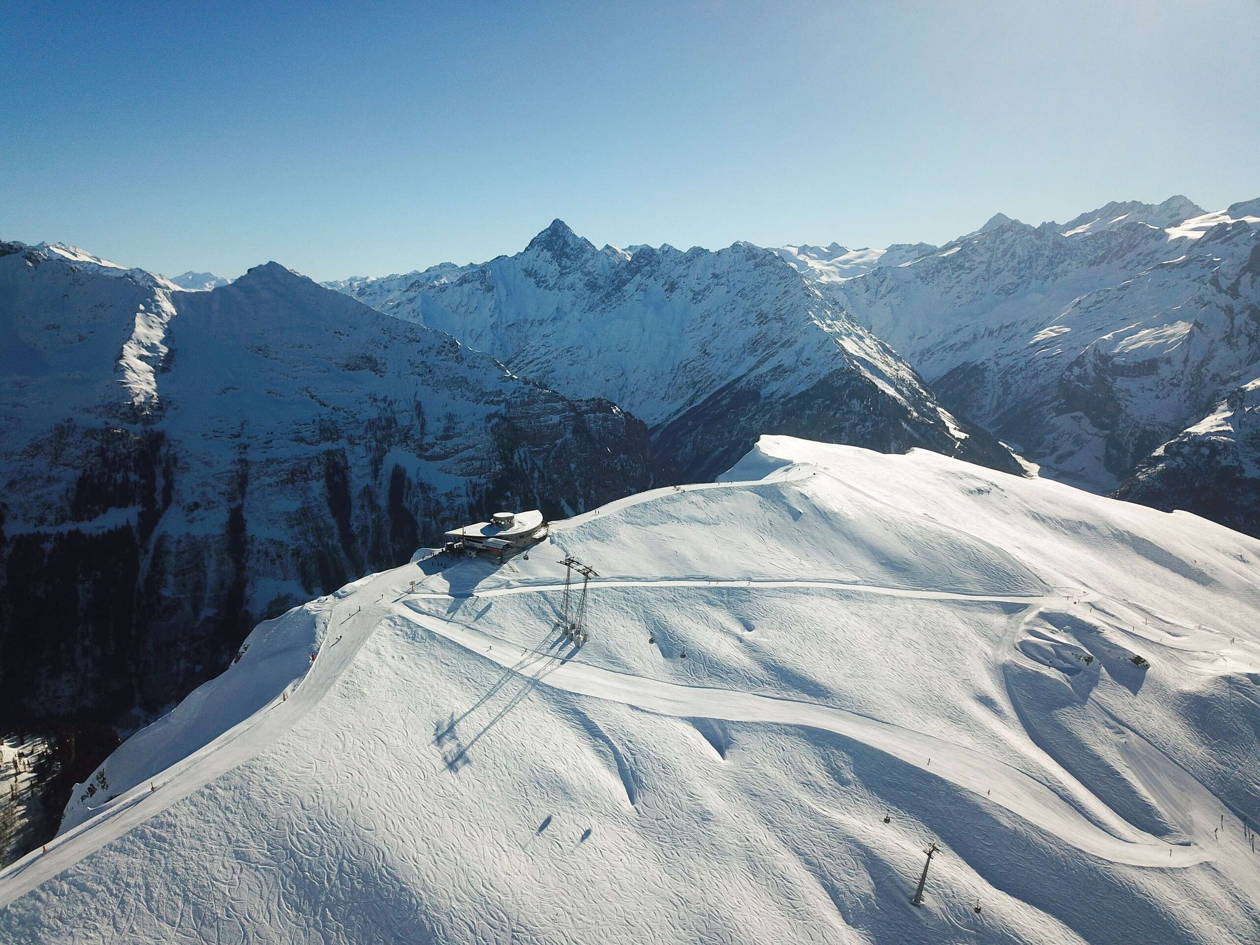 Aerial view of the mountain station and the Alpen tower panorama restaurant on the Hasliberg in winter.